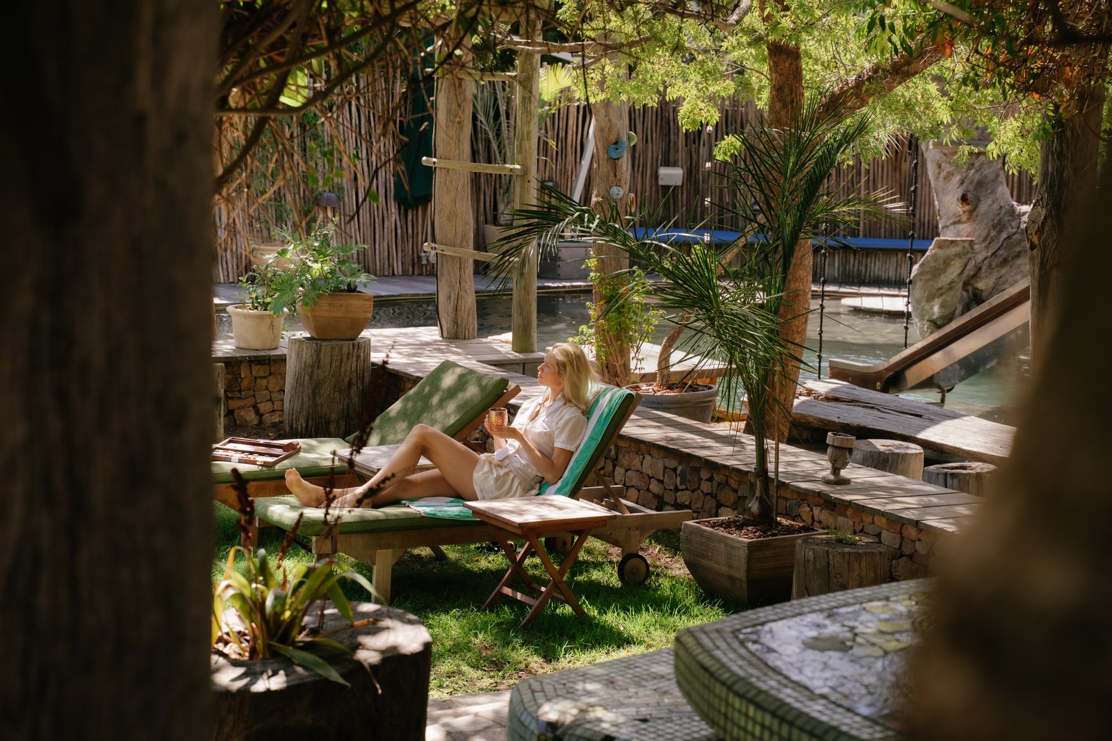 Garden with pool, slide and sun loungers at Wonderland Retreat & Spa, Hout Bay, Cape Town