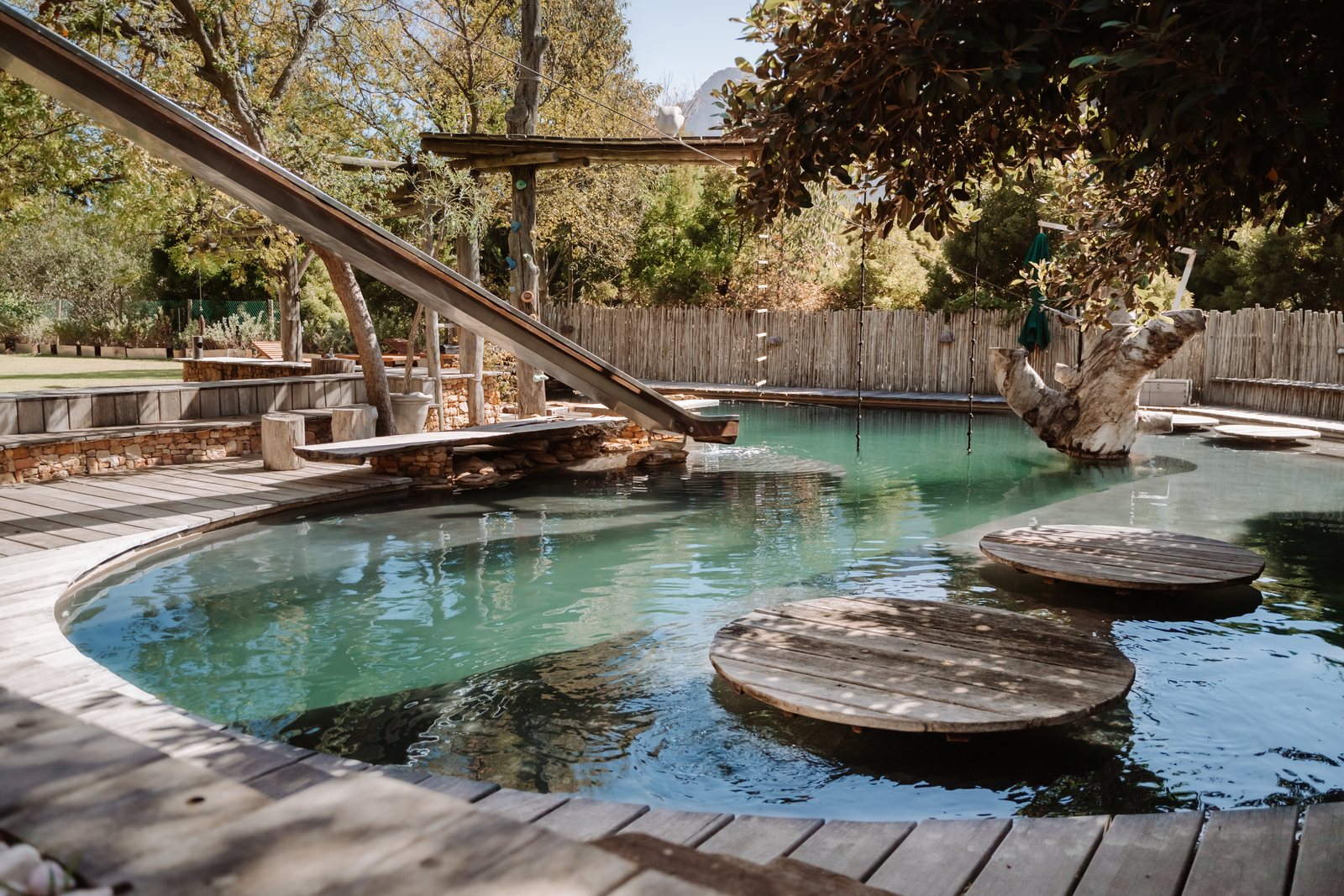 Pool with slide and floating stepping stones at Wonderland Retreat & Spa, Hout Bay, Cape Town