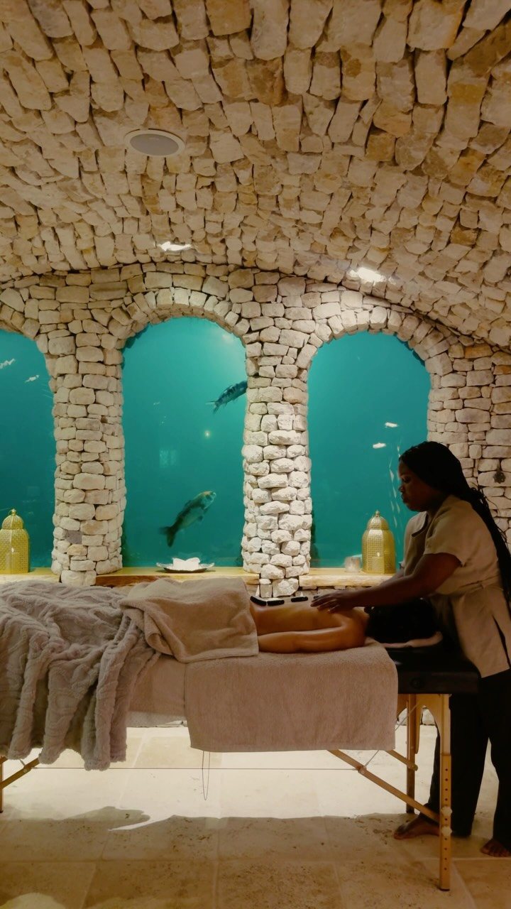Massage in the old wine cellar with a koi window at Wonderland Retreat & Spa, Hout Bay, Cape Town