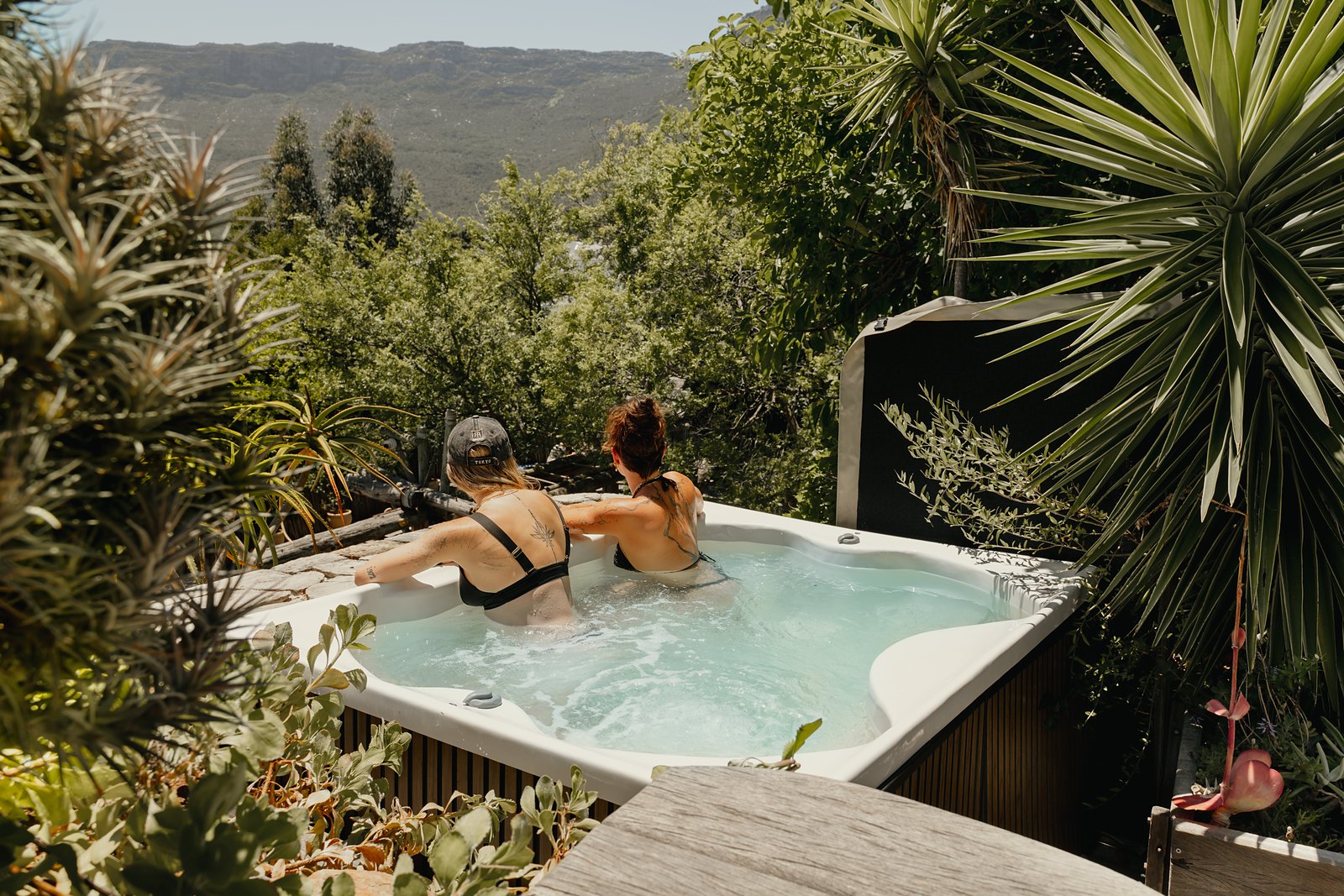 Terrace jacuzzi facing the sunset over the garden at Wonderland Retreat & Spa, Hout Bay, Cape Town